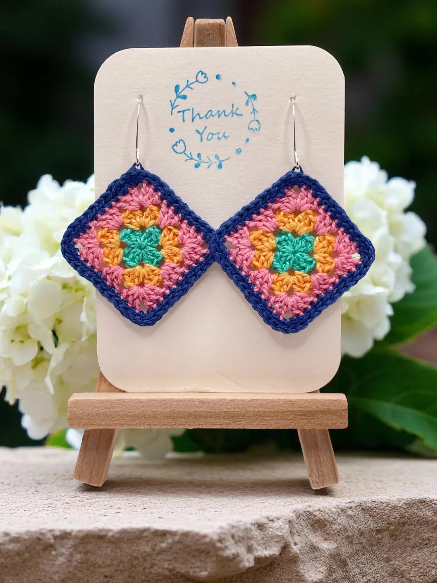 Granny Square earring with bright blue outline Tangles & Twine