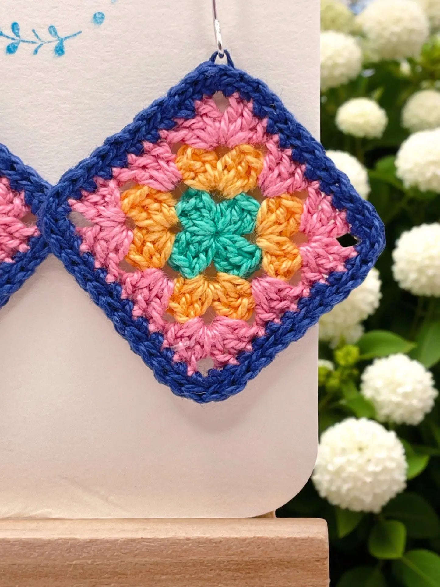 Granny Square earring with bright blue outline Tangles & Twine