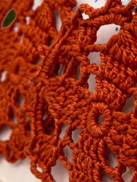 Circular earring in burnt orange Tangles & Twine