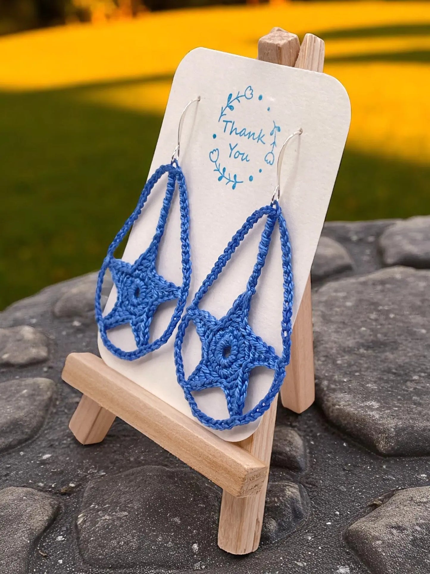 Dangling star in blue Tangles & Twine