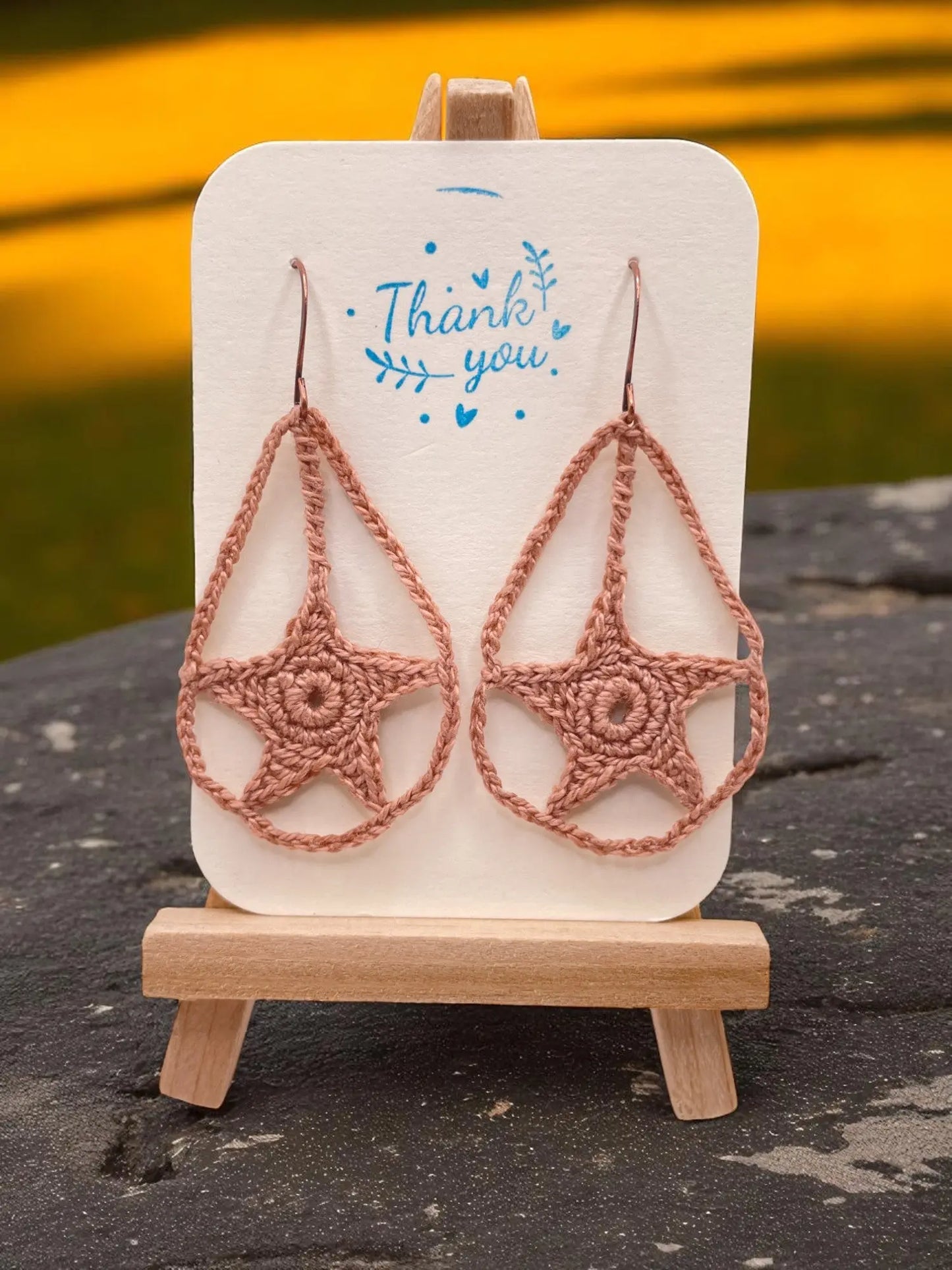 Dangling star in tan Tangles & Twine