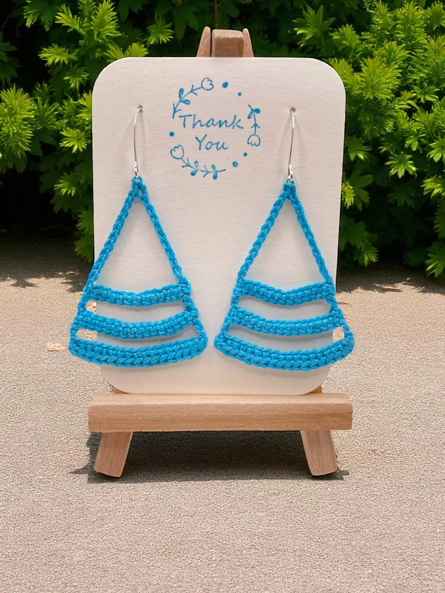 Dangling smiles in sky blue Tangles & Twine