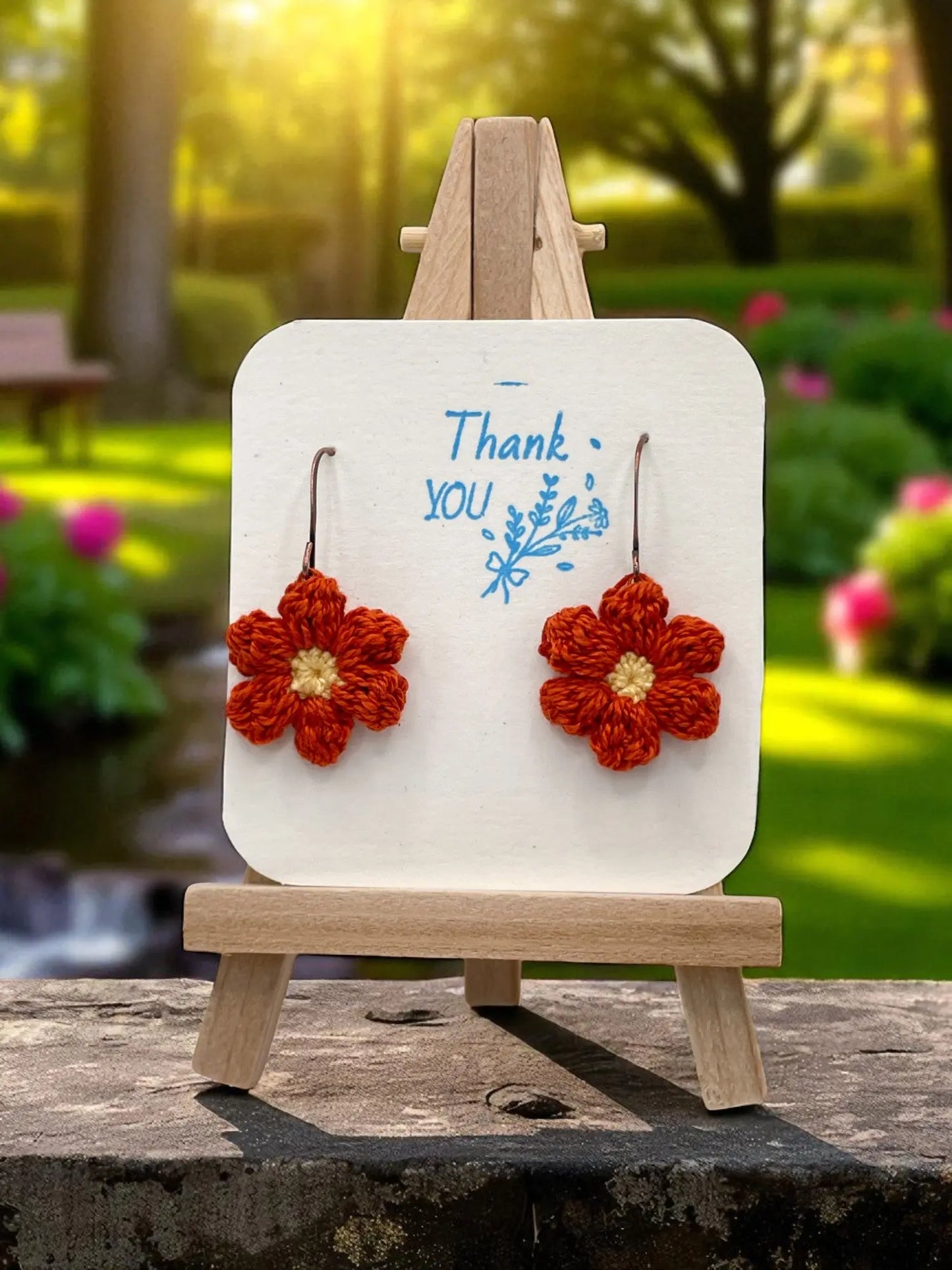 Dangly Puff Flower in burnt orange Tangles & Twine