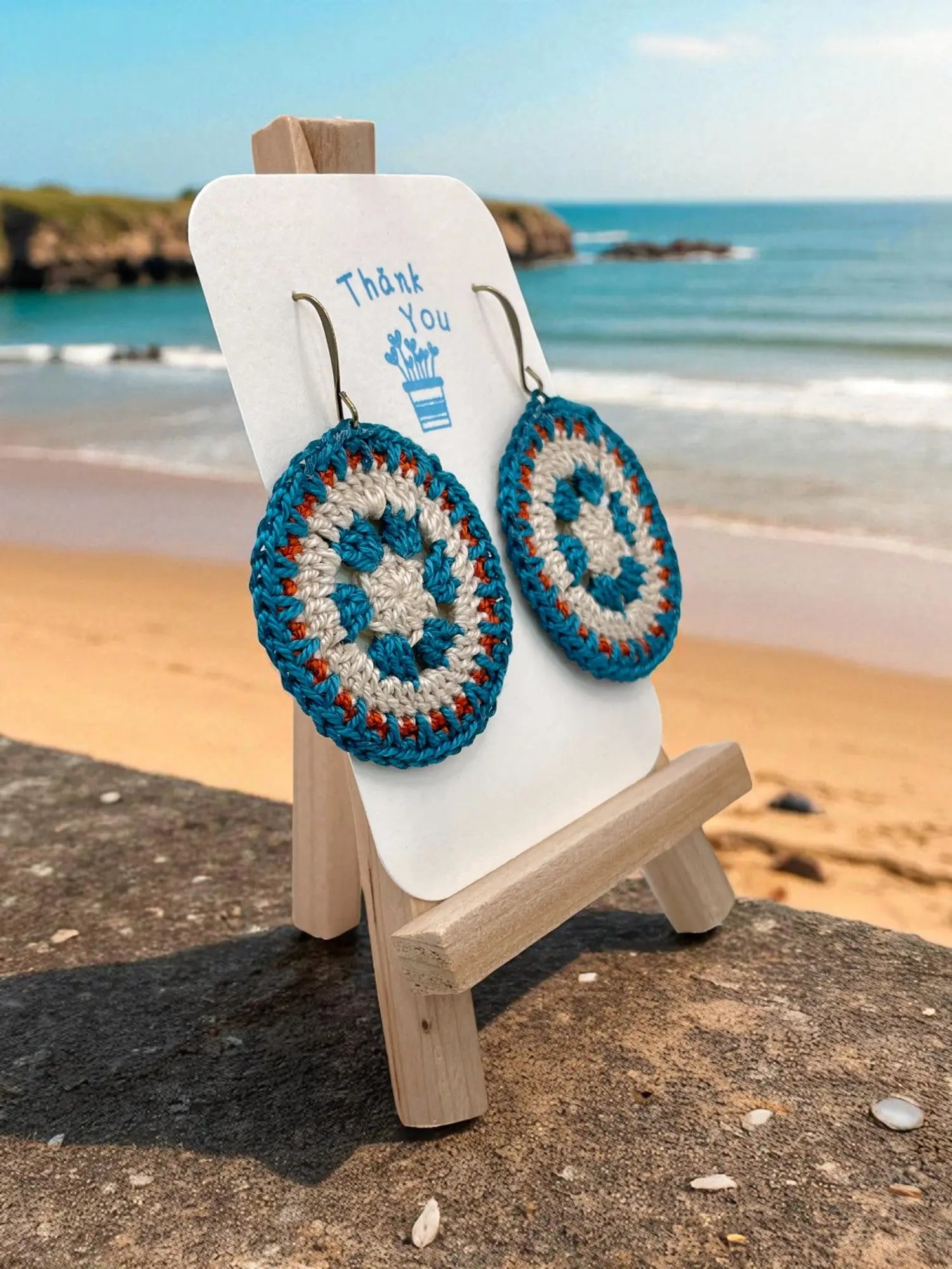 Intricate Discs teal, cream, and orange Tangles & Twine