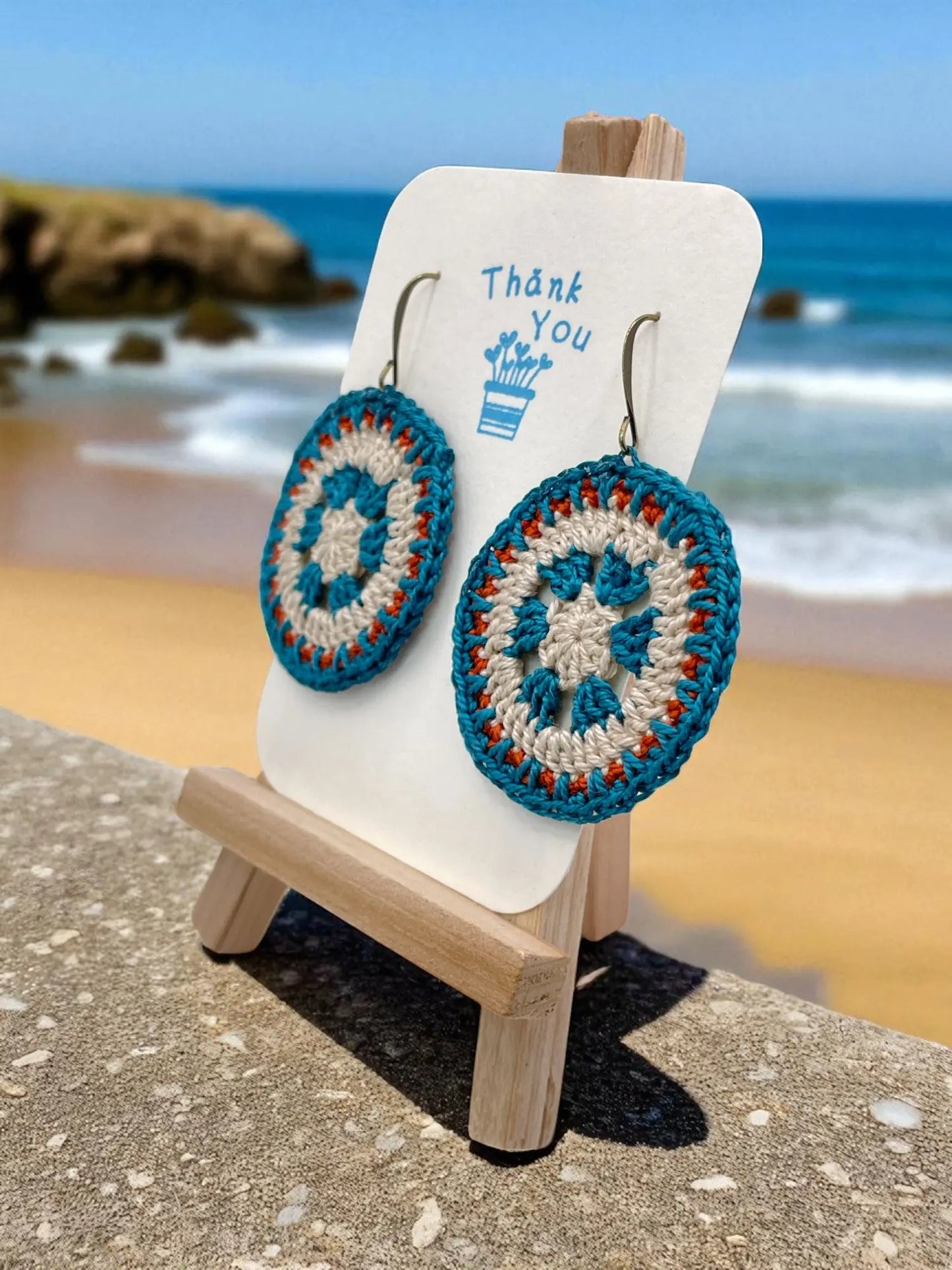 Intricate Discs teal, cream, and orange Tangles & Twine