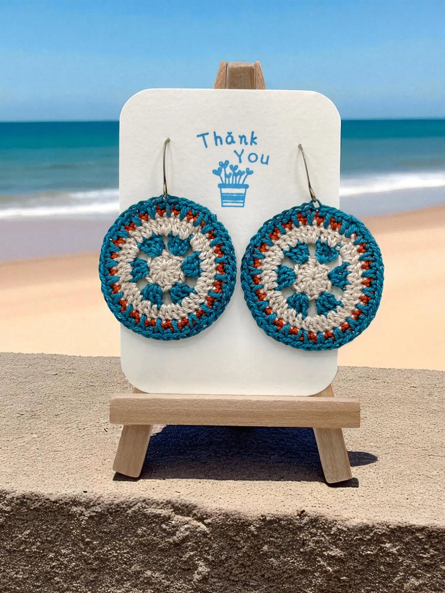 Intricate Discs teal, cream, and orange Tangles & Twine