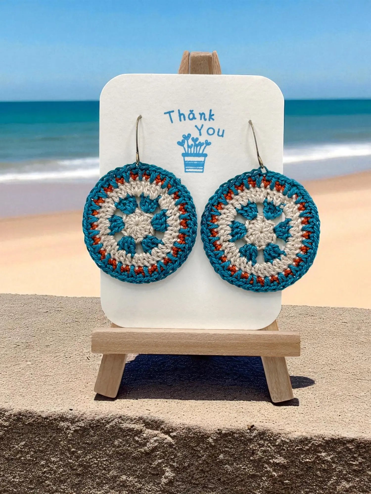 Intricate Discs teal, cream, and orange Tangles & Twine